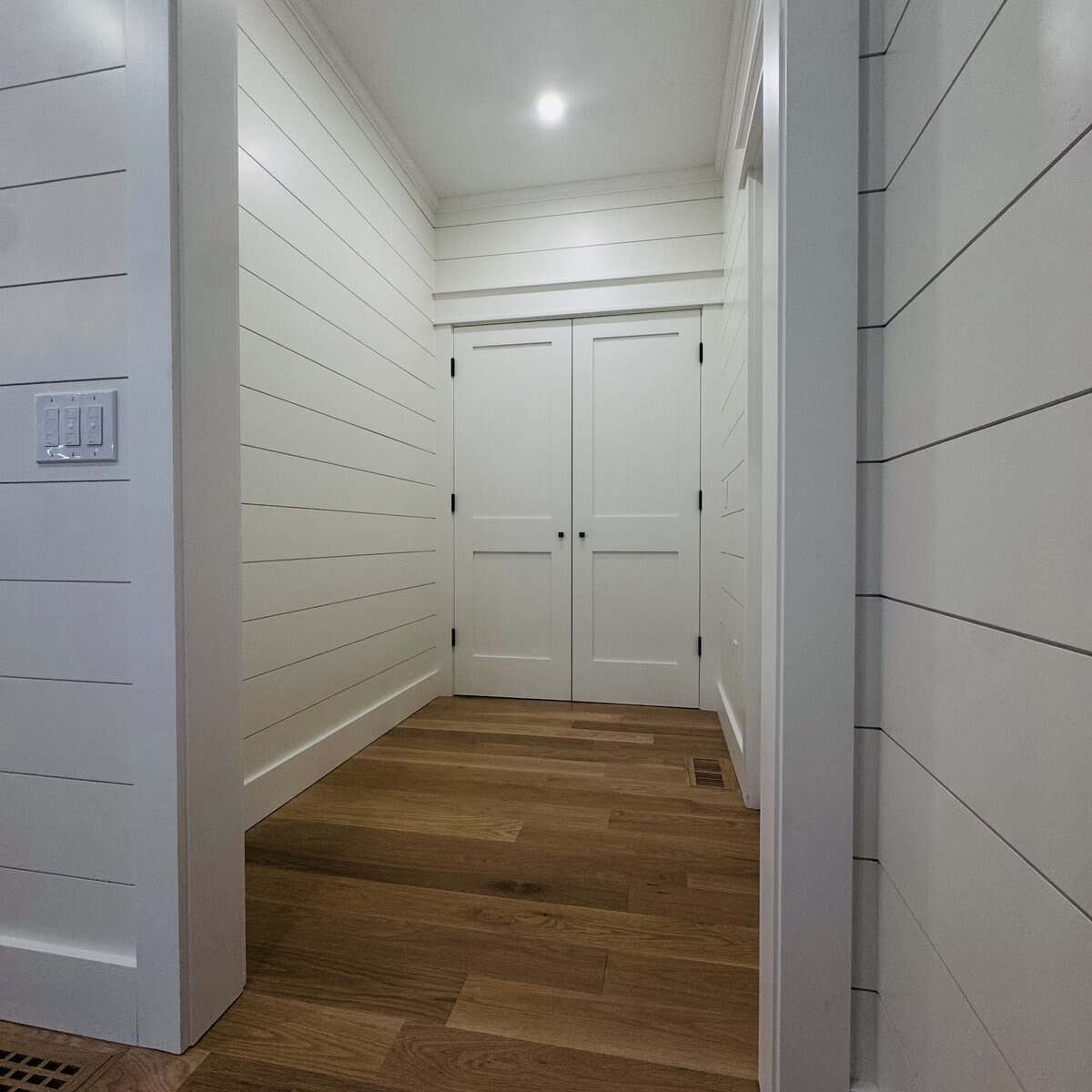 Finished mudroom addition with built-in cubbies by Coast Carpentry at 84 Alden Drive