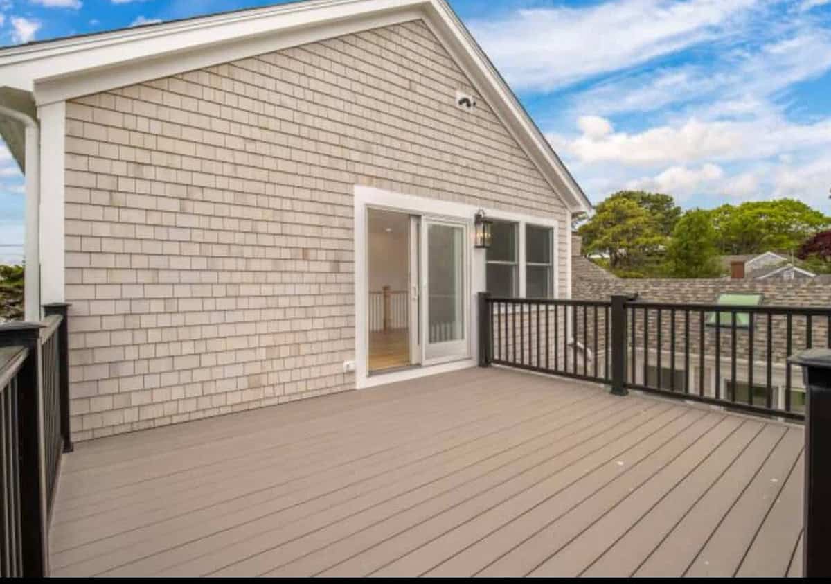 New white cedar shingle siding on the gable end of a Coast Carpentry remodel in Hyannis
