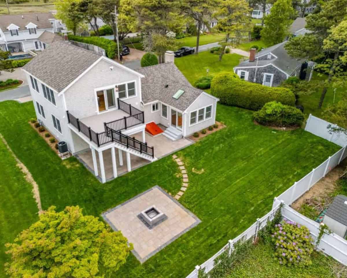 Drone view of a finished Coast Carpentry roof replacement on Cape Cod with new architectural shingles